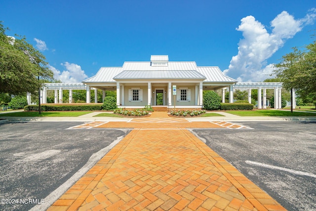 view of front of property with a porch and a pergola