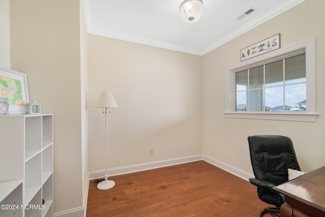 unfurnished office with hardwood / wood-style flooring and ornamental molding