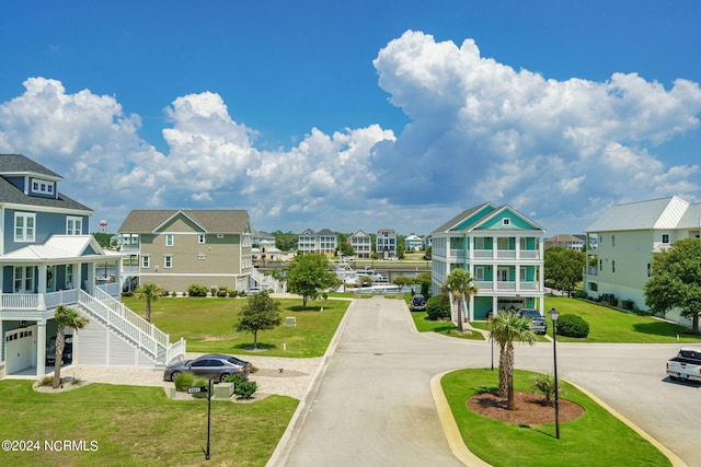 view of home's community featuring a lawn