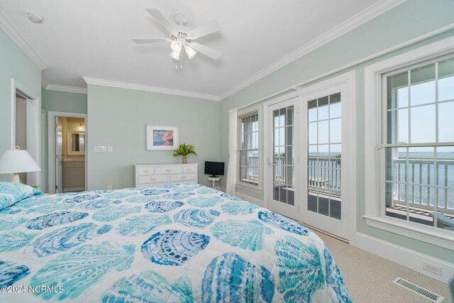 bedroom featuring multiple windows, crown molding, carpet, and access to outside