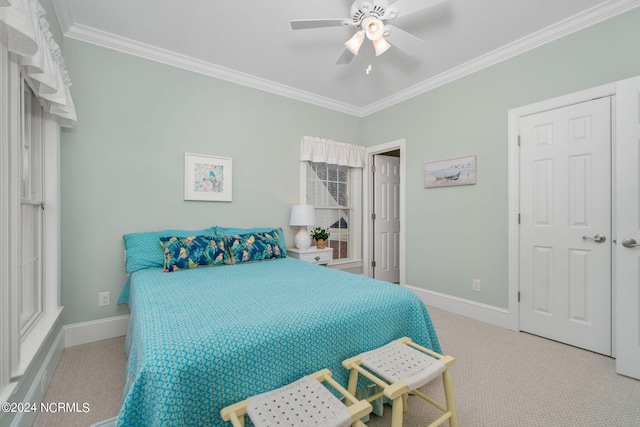 bedroom with crown molding, ceiling fan, and light carpet