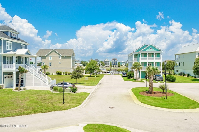 view of home's community with a yard