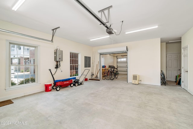 garage featuring a garage door opener, electric panel, and water heater