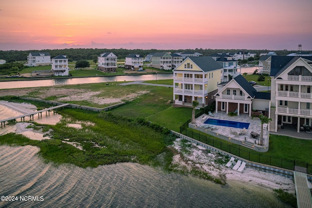 aerial view at dusk with a water view