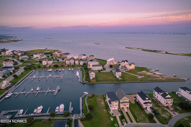 aerial view at dusk with a water view