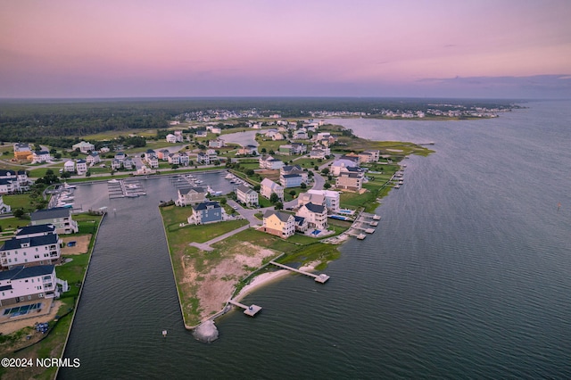 aerial view at dusk with a water view