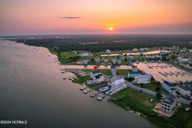 aerial view at dusk with a water view