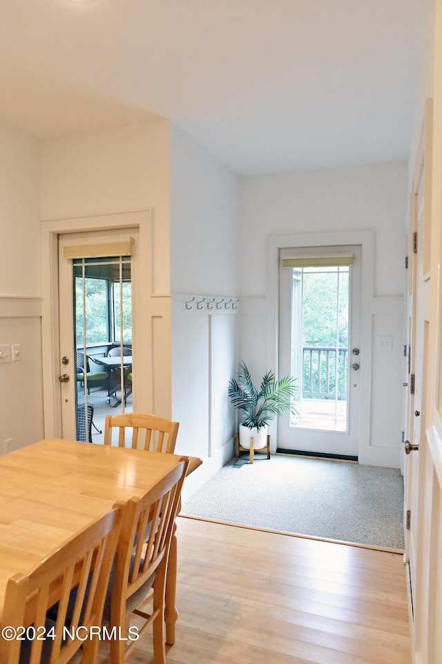 dining room with plenty of natural light and light wood-type flooring