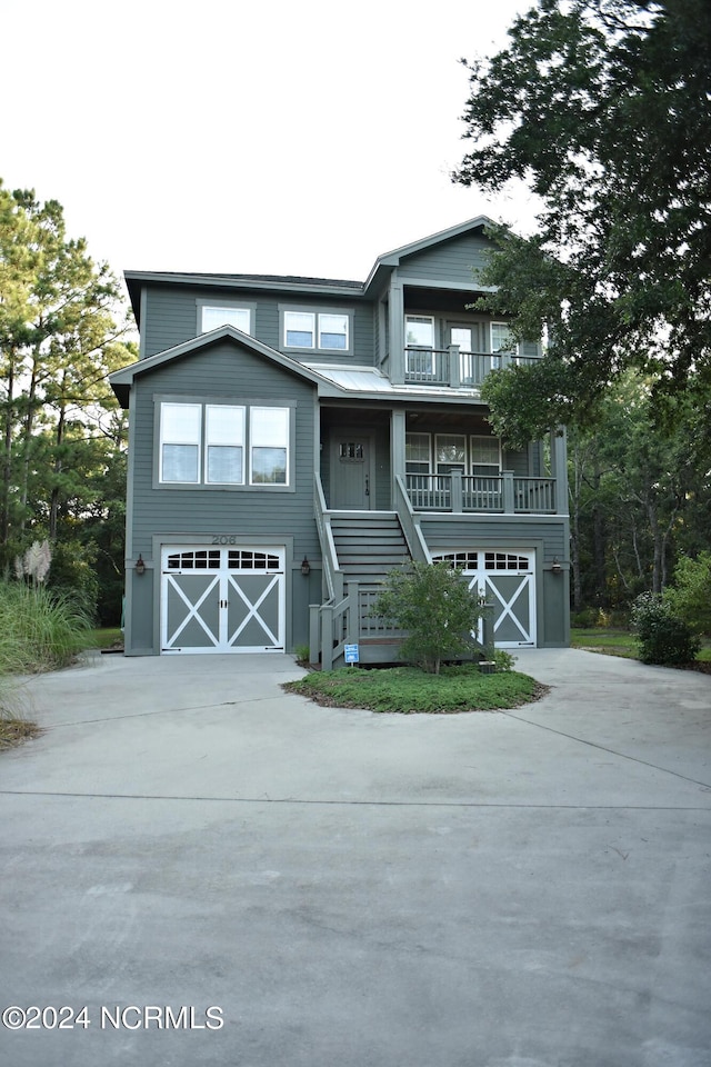 view of front of home featuring a garage and a porch