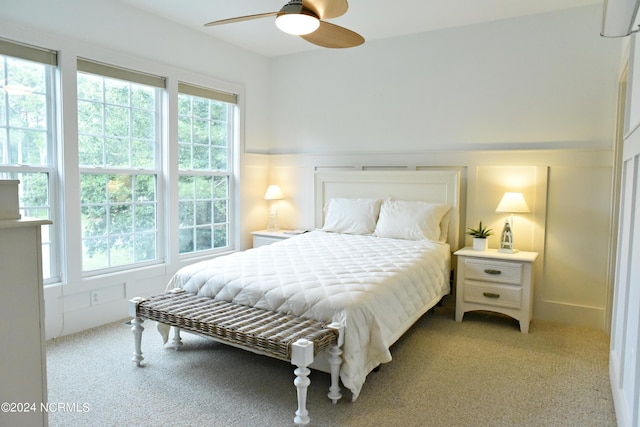 bedroom with light colored carpet and ceiling fan