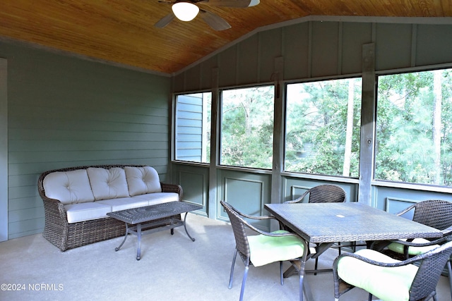 sunroom with lofted ceiling, wood ceiling, and ceiling fan