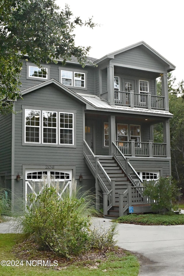 view of front of home featuring a garage and a porch