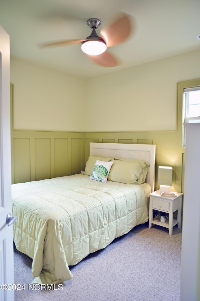 bedroom with ceiling fan and carpet flooring