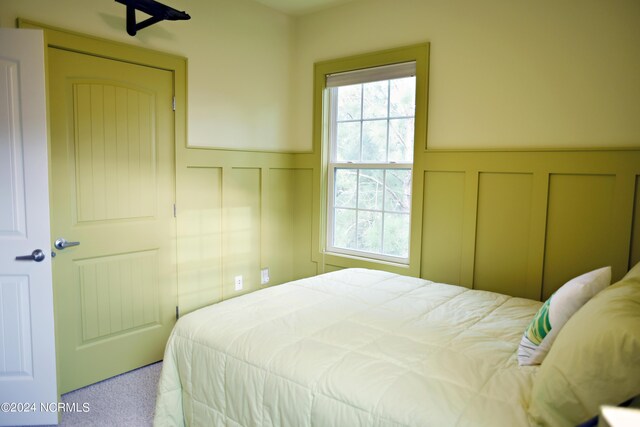 bedroom with multiple windows