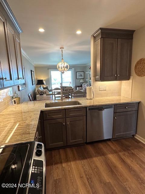 kitchen featuring dark hardwood / wood-style floors, dark brown cabinetry, tasteful backsplash, and dishwasher