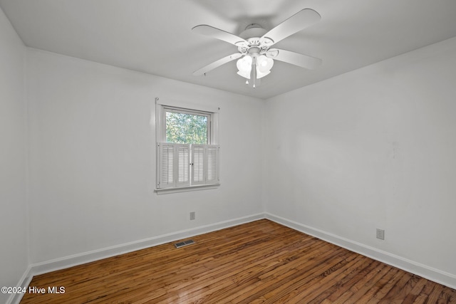 empty room featuring ceiling fan and hardwood / wood-style flooring