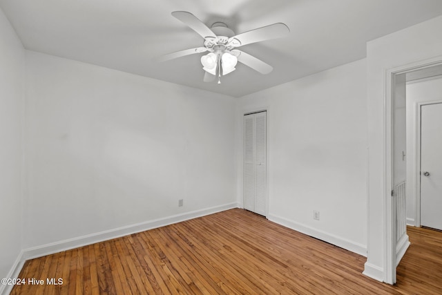 spare room featuring ceiling fan and light hardwood / wood-style flooring