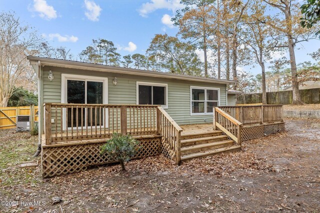 back of property featuring a wooden deck