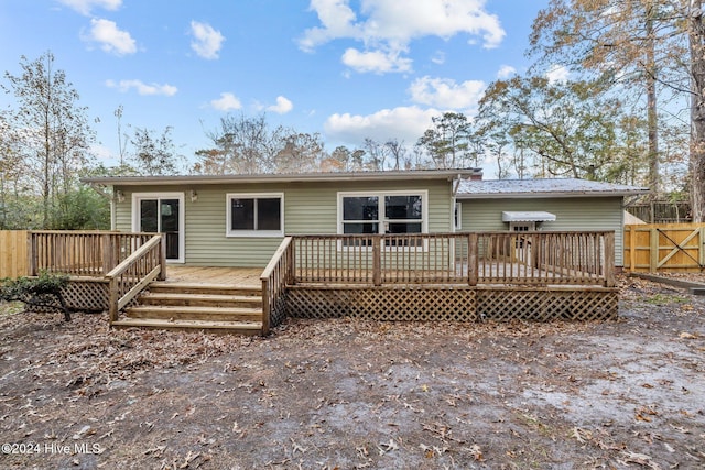 back of house featuring a deck