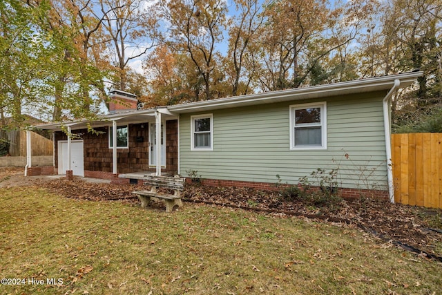 ranch-style home with a front yard