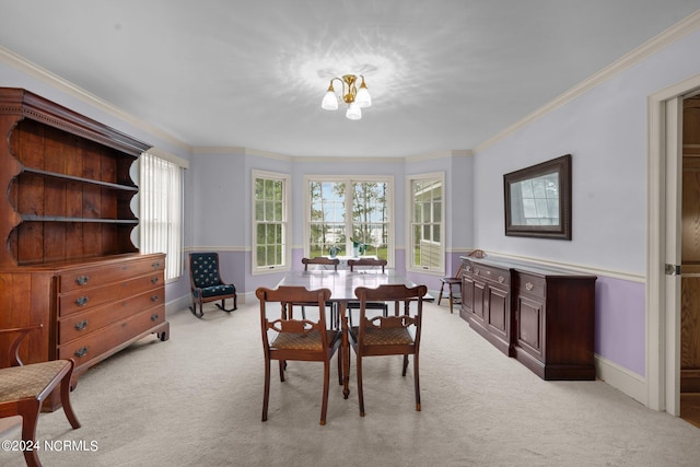 dining room featuring light carpet and ornamental molding