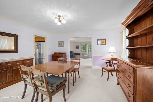 dining space with light carpet and ornamental molding