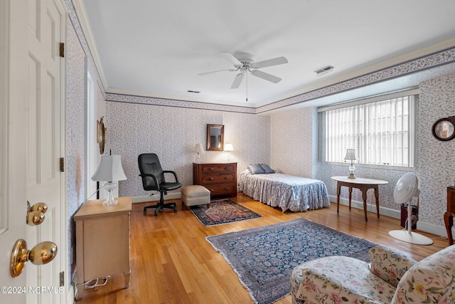 bedroom with ceiling fan and light hardwood / wood-style flooring