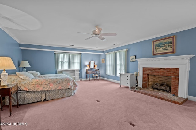 bedroom with multiple windows, a fireplace, ceiling fan, and carpet flooring