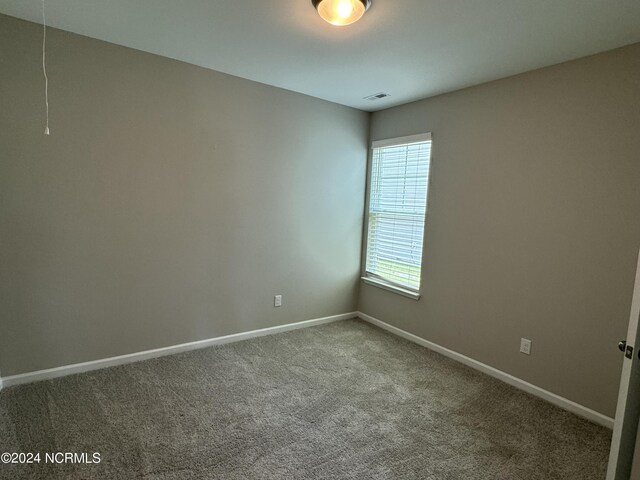 empty room featuring carpet floors