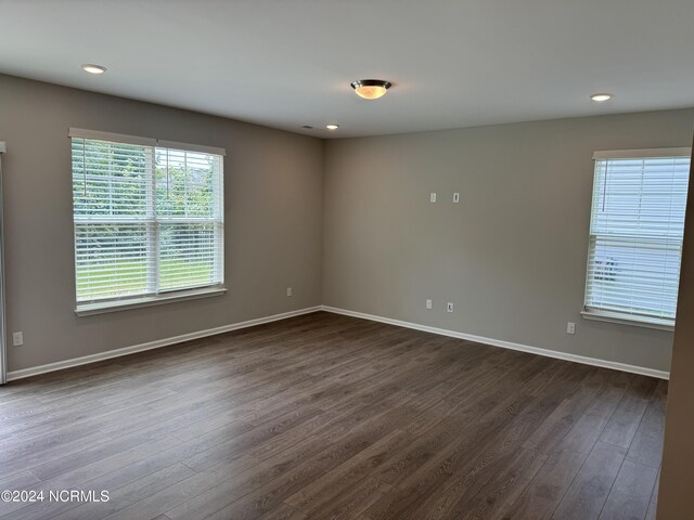 empty room with hardwood / wood-style floors