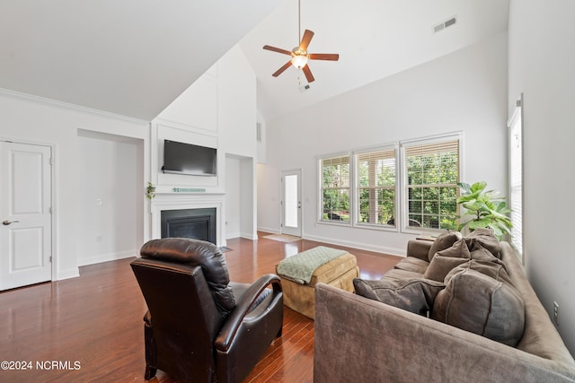 living room with ceiling fan, high vaulted ceiling, and dark hardwood / wood-style flooring