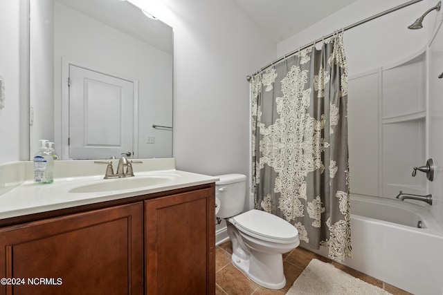 full bathroom featuring vanity, shower / tub combo, tile patterned floors, and toilet