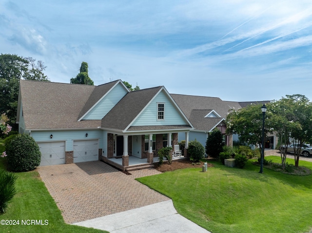 view of front of property with covered porch and a front lawn