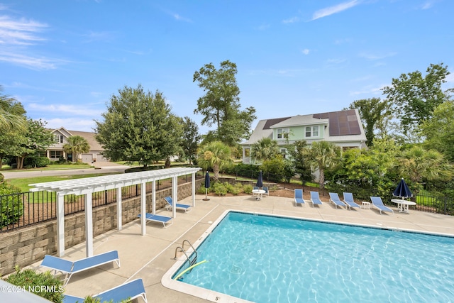 view of swimming pool featuring a patio area