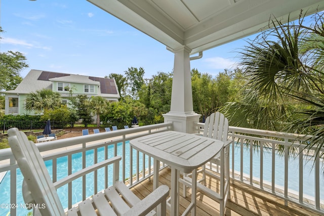 balcony featuring a water view