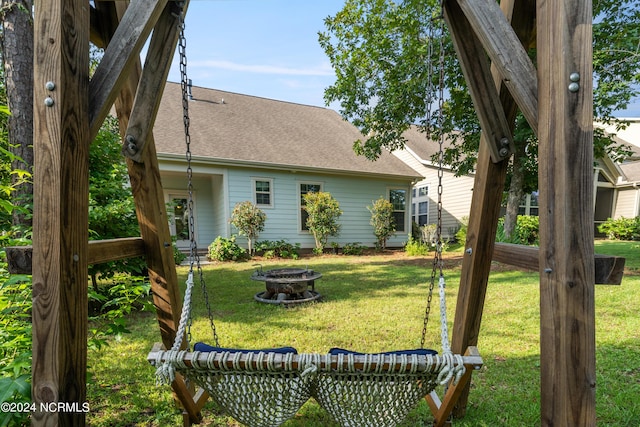 view of yard with an outdoor fire pit