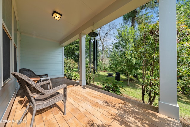 wooden deck featuring covered porch