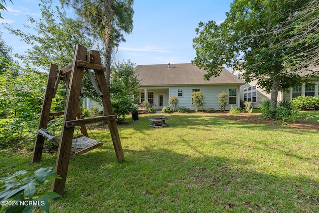 view of yard featuring an outdoor fire pit