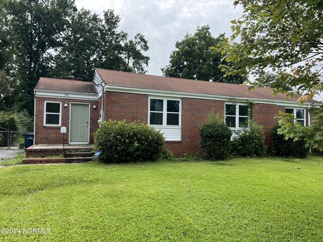 view of front of home with a front yard