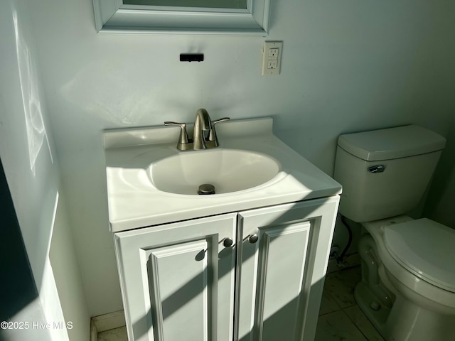 half bath with toilet and vanity