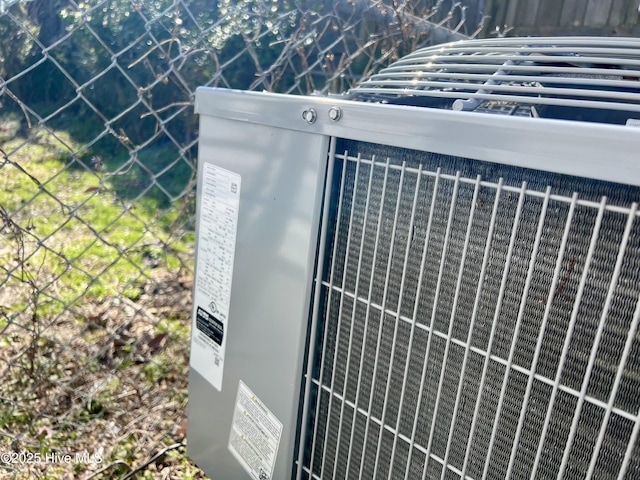 exterior details featuring central air condition unit and fence