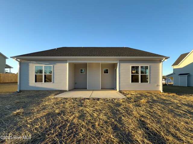 back of house with a patio