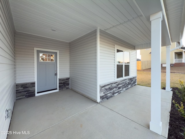 property entrance featuring a patio