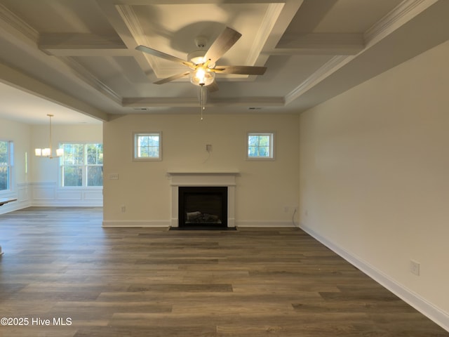 unfurnished living room with dark hardwood / wood-style floors, coffered ceiling, ornamental molding, ceiling fan with notable chandelier, and beamed ceiling