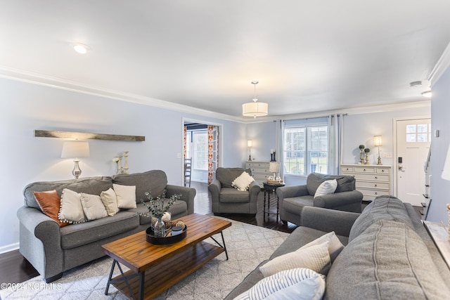 living room featuring light hardwood / wood-style flooring and crown molding