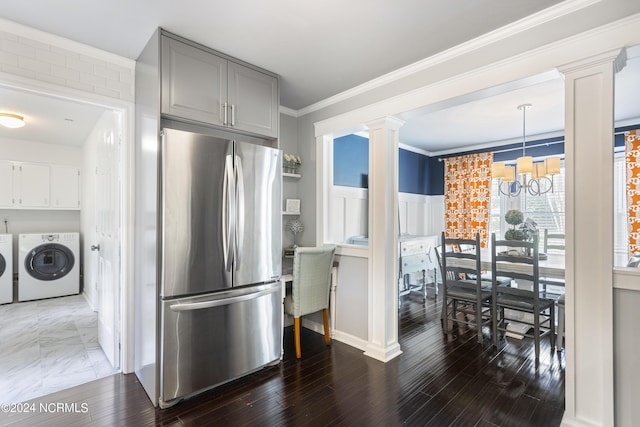 kitchen featuring washer and dryer, gray cabinets, stainless steel fridge, a notable chandelier, and dark hardwood / wood-style flooring