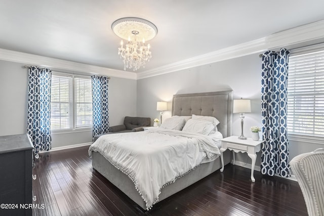 bedroom featuring a chandelier, dark hardwood / wood-style flooring, and ornamental molding