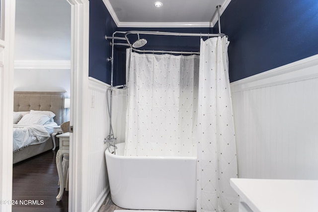 bathroom featuring hardwood / wood-style floors, vanity, and crown molding