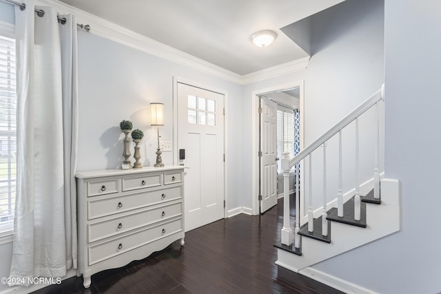 entrance foyer with crown molding and dark wood-type flooring