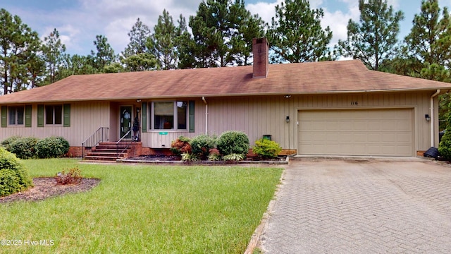 ranch-style home featuring a front yard and a garage